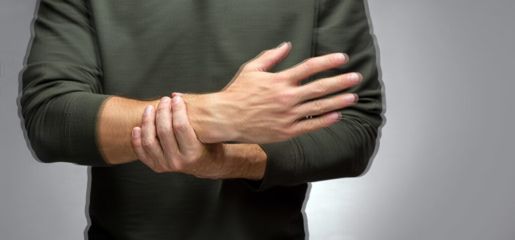 a motion blurred image of a person with wrist pain